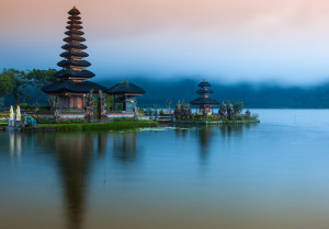 ULUN DANU TEMPLE. This temple on the shores of Lake Bratan is second only to Pura Besakih in significance, but for rice farmers in Bali, this temple is the foremost on the island. Pura Ulun Danu Bratan is the primary temple in the many temples and shrines that punctuate the subak irrigation system popular in Bali. The temple is dedicated to the worship of the goddess of lakes and rivers, Dewi Batari Ulun Danu. Part of the temple is located on the mainland, while a significant section seems to "float" on the lake, being set on an island just off the mainland temple complex. An 11-roof meru (pagoda) sits on the island section, a towering beauty surrounded by a placid lake.